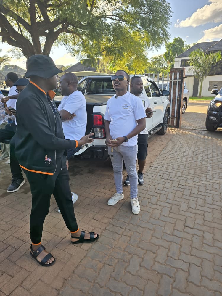 Mr Mawena arriving at J&B Motors in his black cap and jacket — the moment before he knew