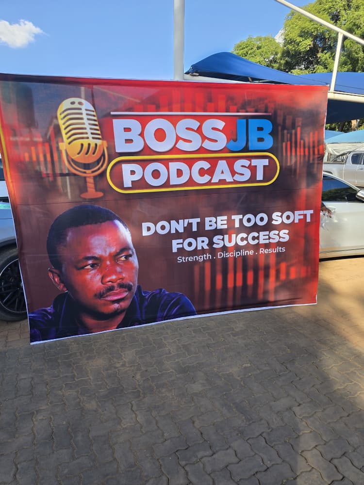 Boss JB Podcast banner — Don't Be Too Soft For Success — at the J&B forecourt